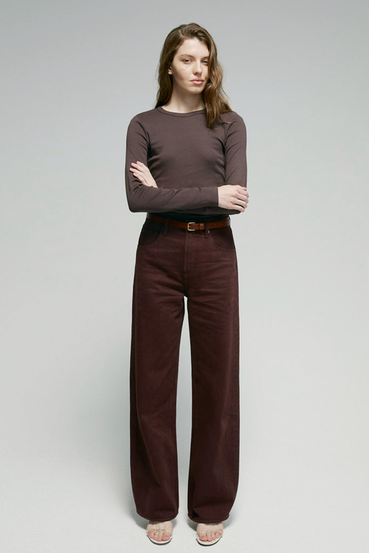 High-rise relaxed wide-leg jeans in mid-weight non-stretch cotton denim, front view showing button closure and full-length leg