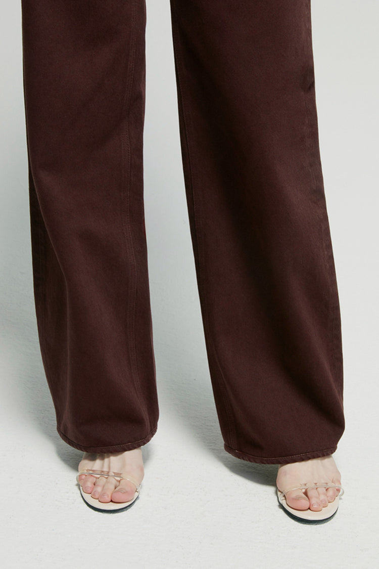 High-rise relaxed wide-leg jeans in mid-weight non-stretch cotton denim, front view showing button closure and full-length leg