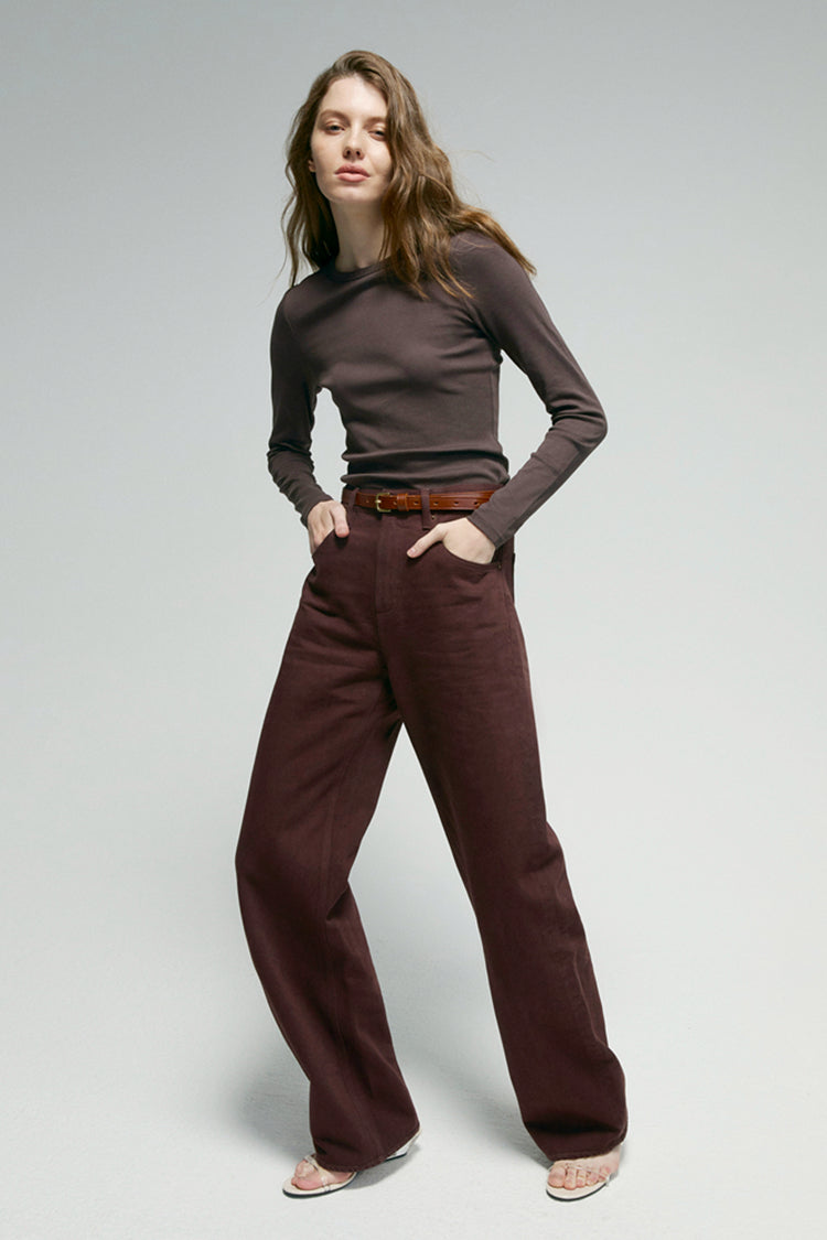 High-rise relaxed wide-leg jeans in mid-weight non-stretch cotton denim, front view showing button closure and full-length leg