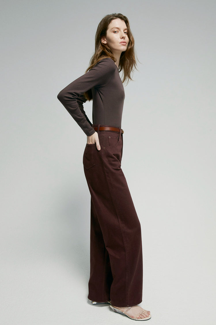 High-rise relaxed wide-leg jeans in mid-weight non-stretch cotton denim, front view showing button closure and full-length leg