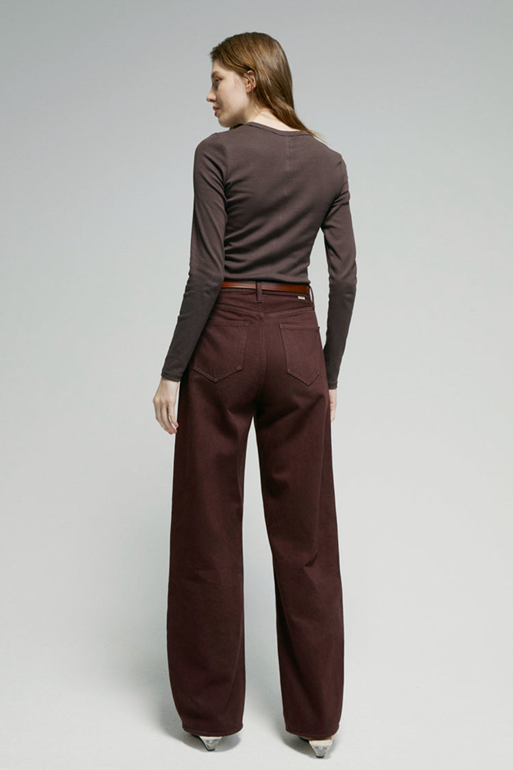 High-rise relaxed wide-leg jeans in mid-weight non-stretch cotton denim, front view showing button closure and full-length leg