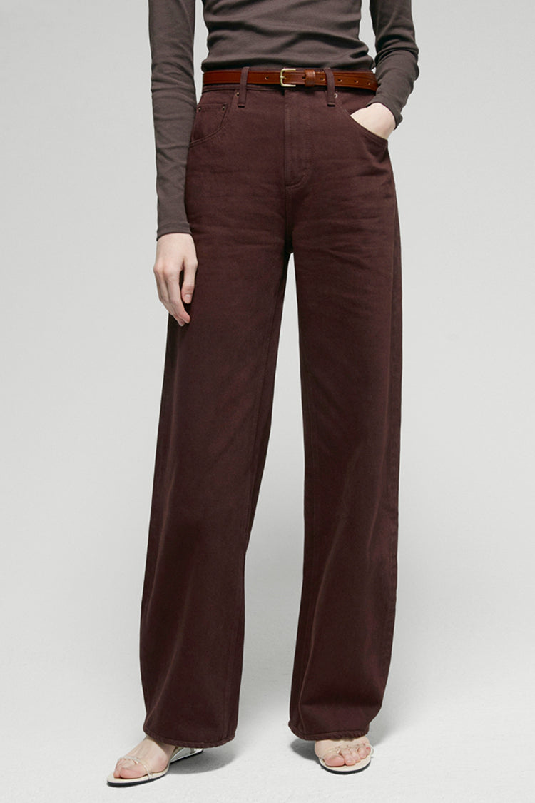 High-rise relaxed wide-leg jeans in mid-weight non-stretch cotton denim, front view showing button closure and full-length leg