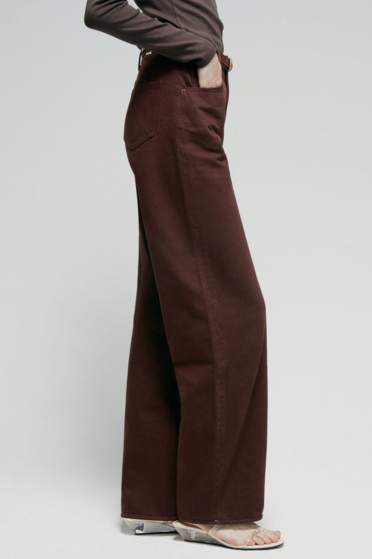 High-rise relaxed wide-leg jeans in mid-weight non-stretch cotton denim, front view showing button closure and full-length leg