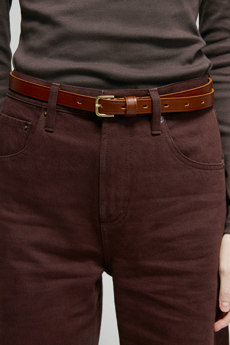 High-rise relaxed wide-leg jeans in mid-weight non-stretch cotton denim, front view showing button closure and full-length leg