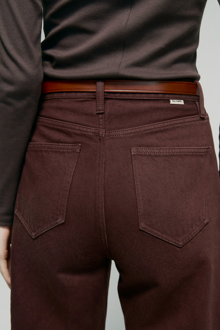 High-rise relaxed wide-leg jeans in mid-weight non-stretch cotton denim, front view showing button closure and full-length leg