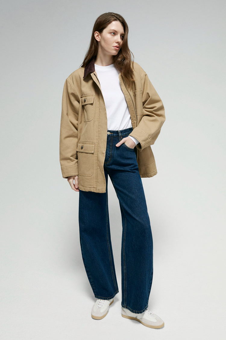 High-rise relaxed wide-leg jeans in mid-weight non-stretch cotton denim, front view showing button closure and full-length leg