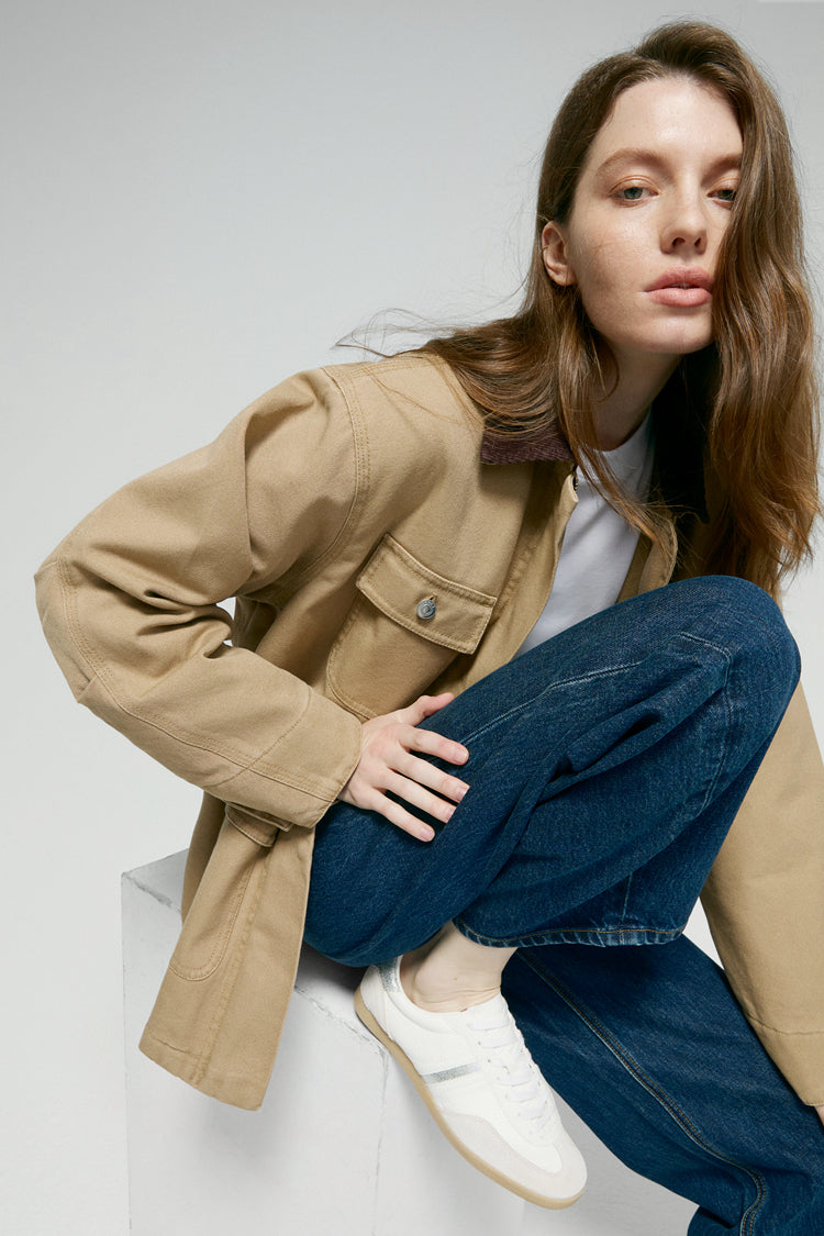 High-rise relaxed wide-leg jeans in mid-weight non-stretch cotton denim, front view showing button closure and full-length leg