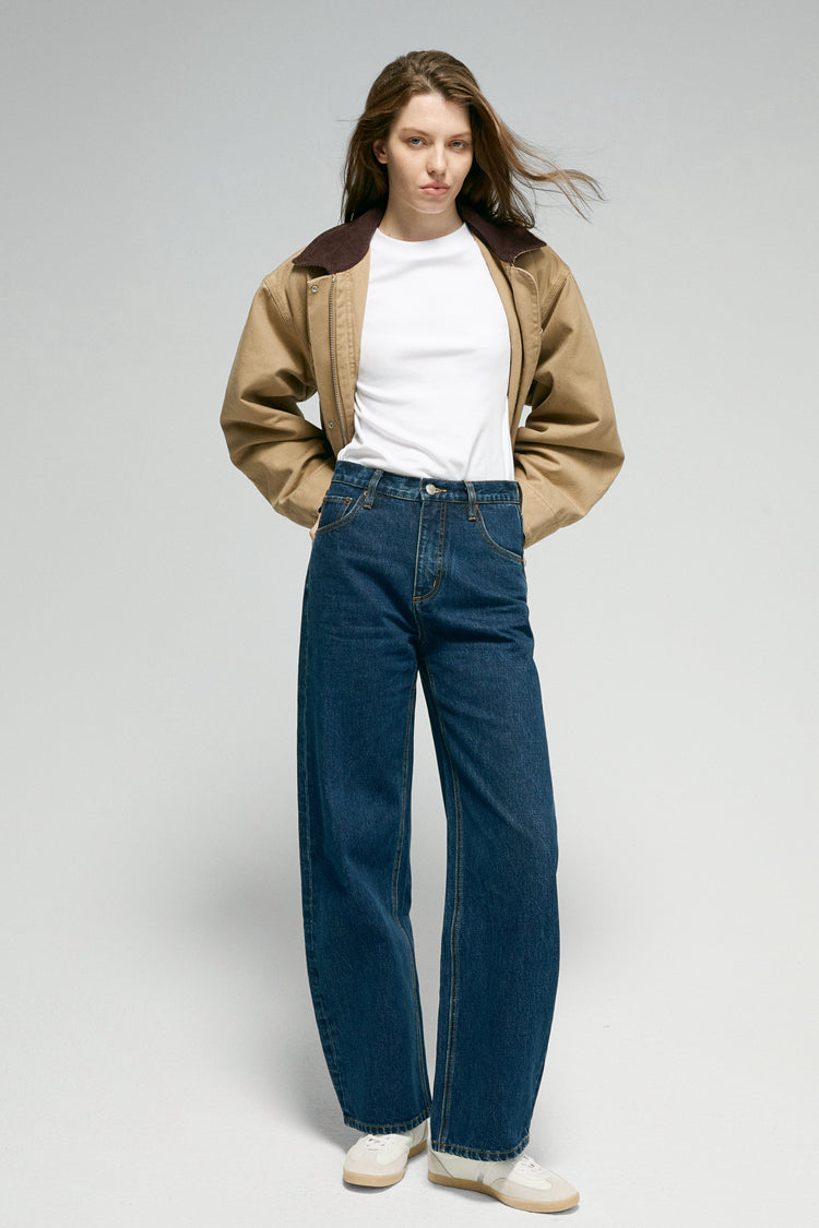 High-rise relaxed wide-leg jeans in mid-weight non-stretch cotton denim, front view showing button closure and full-length leg