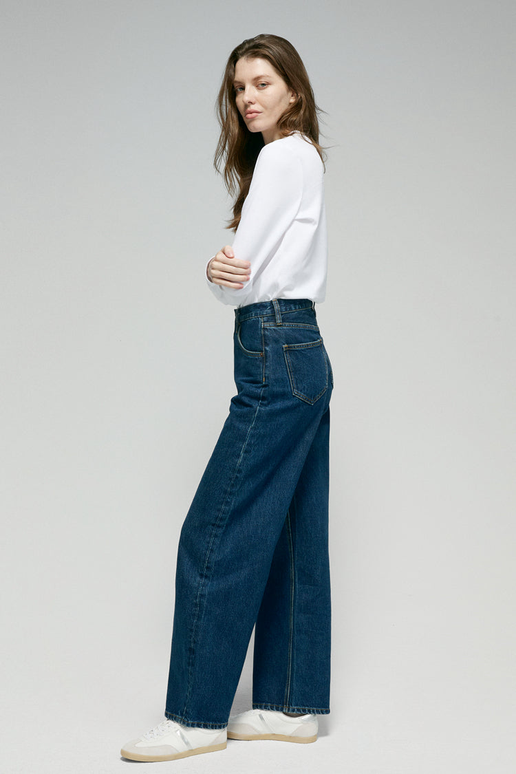 High-rise relaxed wide-leg jeans in mid-weight non-stretch cotton denim, front view showing button closure and full-length leg