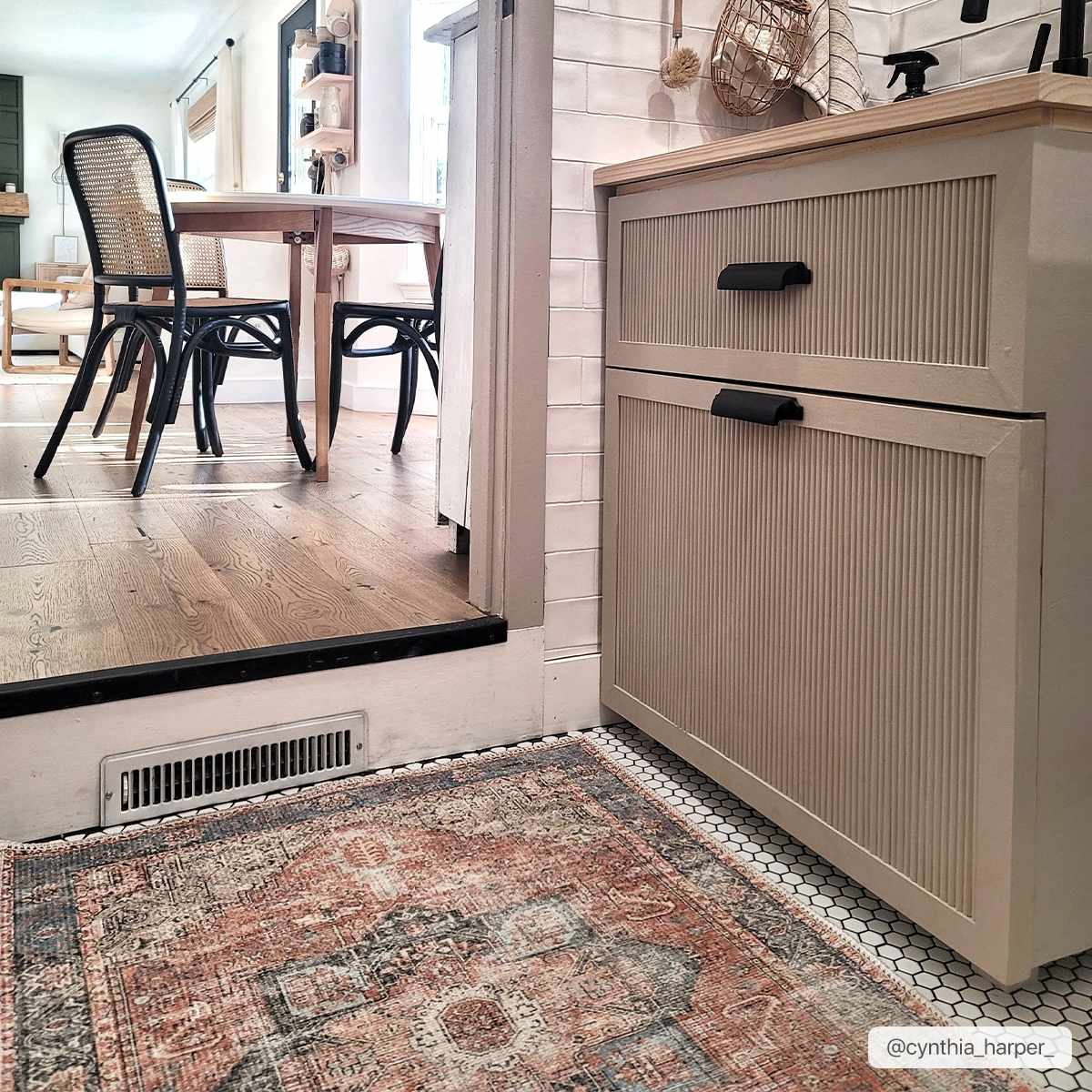Rosman distressed flat weave area rug in warm red, blue, and earthy tones with vintage-inspired pattern