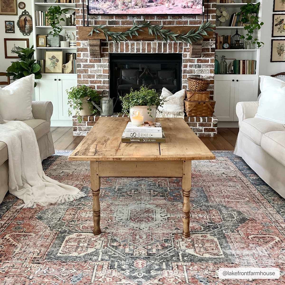 Rosman distressed flat weave area rug in warm red, blue, and earthy tones with vintage-inspired pattern