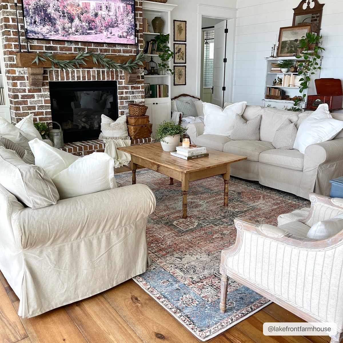 Rosman distressed flat weave area rug in warm red, blue, and earthy tones with vintage-inspired pattern