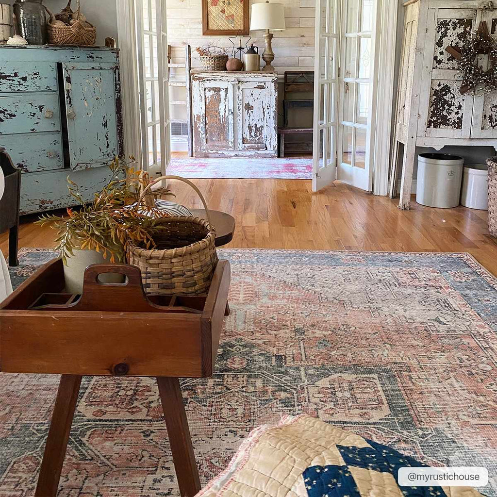 Rosman distressed flat weave area rug in warm red, blue, and earthy tones with vintage-inspired pattern