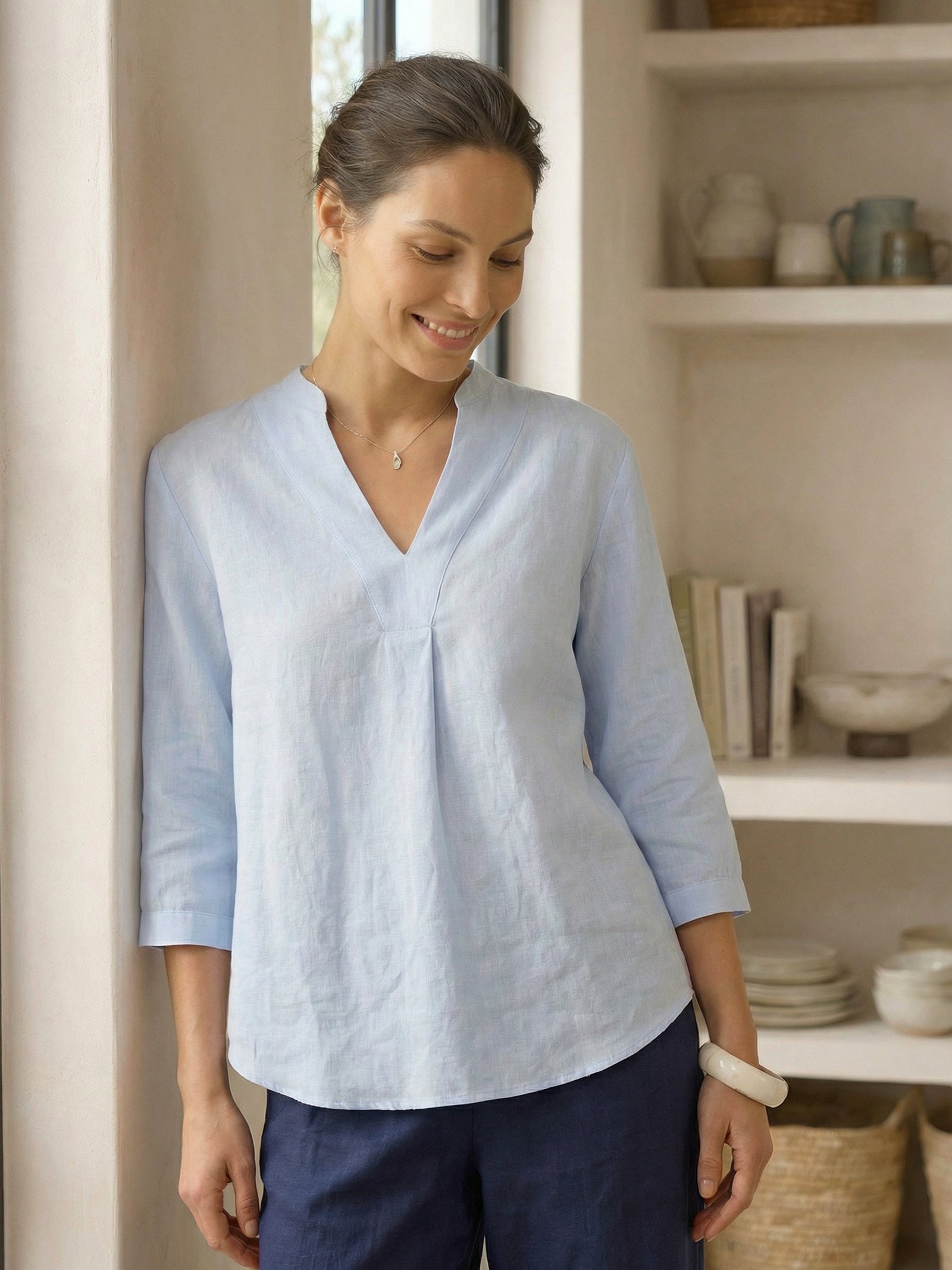 Relaxed-fit 100% linen shirt dress with stand-up collar and side vents in a soft natural tone