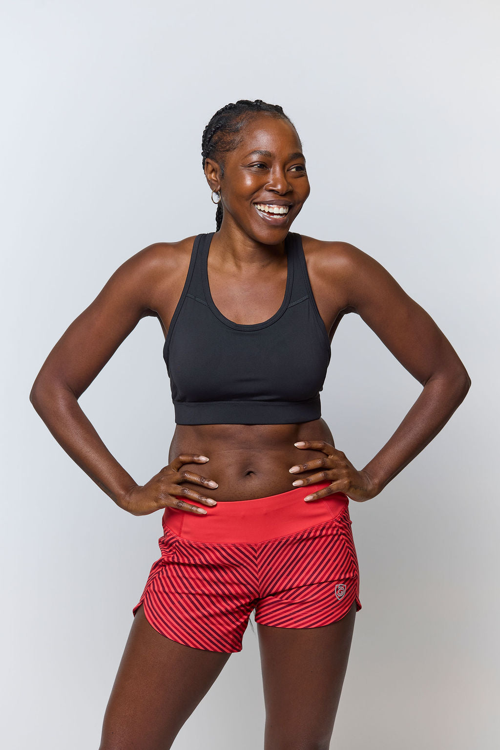 Front view of the 99'er padded sports bra in a solid colorway showing the crossover hexagonal back detail and sleek silhouette