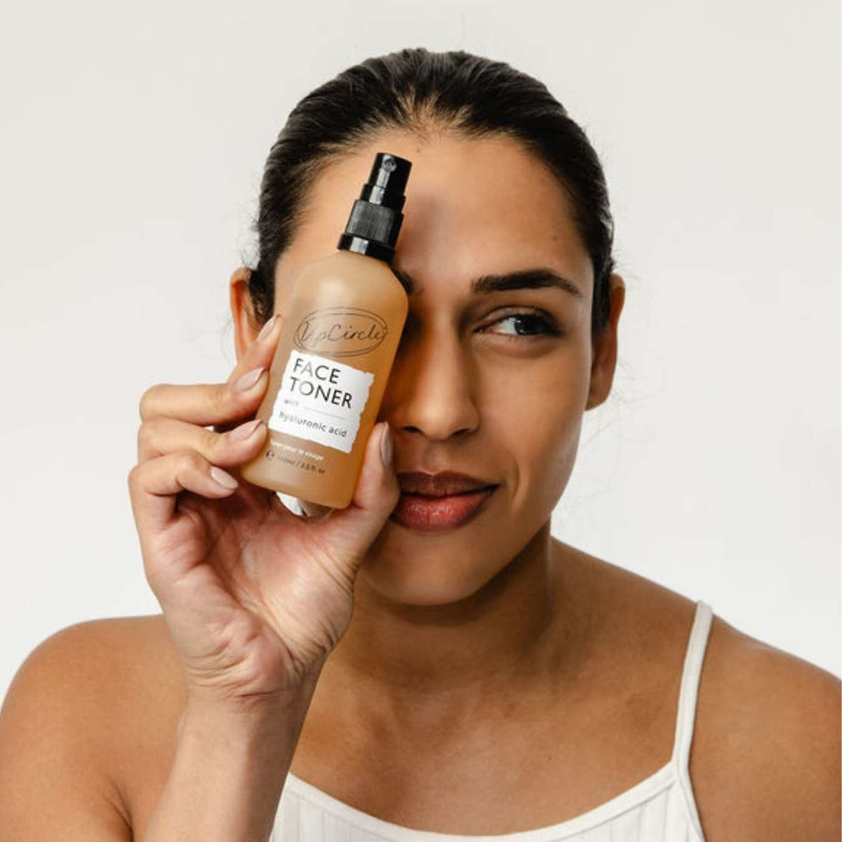 UpCircle Hyaluronic Acid and Chamomile Face Toner in a glass spray bottle with cardboard packaging on a clean surface