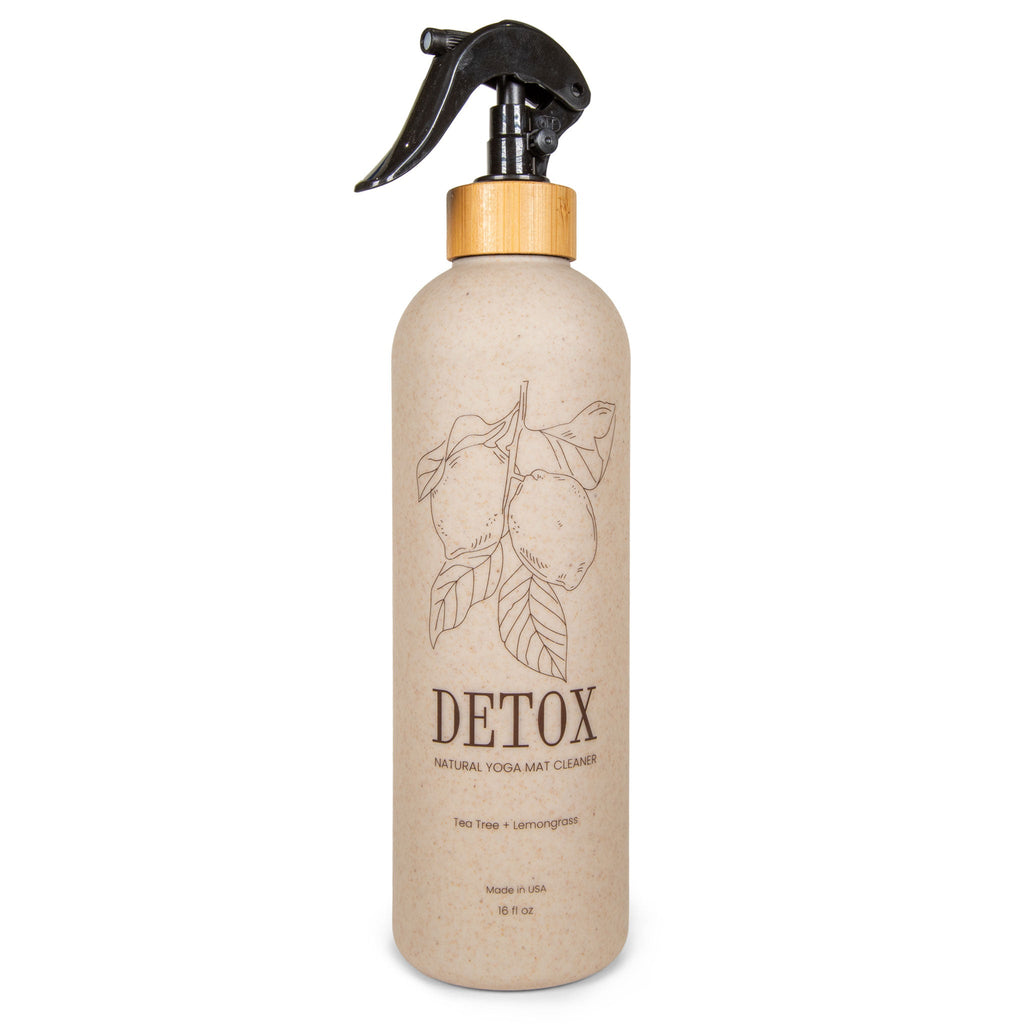 16oz wheat straw bottle of organic cork yoga mat cleaner spray on a cork yoga mat