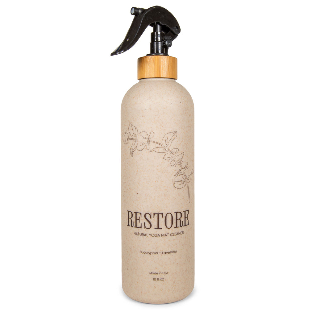 16oz wheat straw bottle of organic cork yoga mat cleaner spray on a cork yoga mat