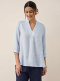 Relaxed-fit 100% linen shirt dress with stand-up collar and side vents in a soft natural tone