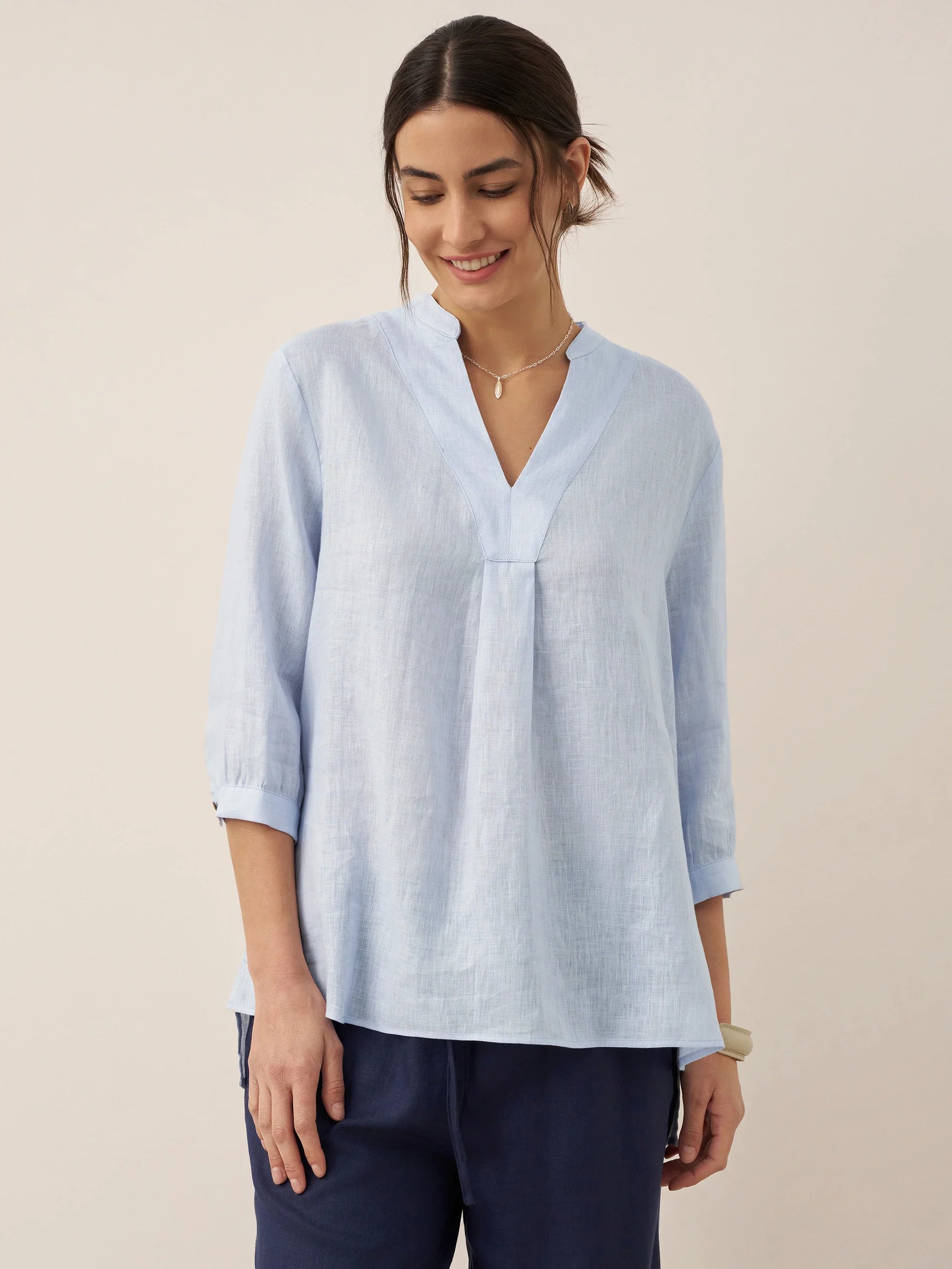 Relaxed-fit 100% linen shirt dress with stand-up collar and side vents in a soft natural tone