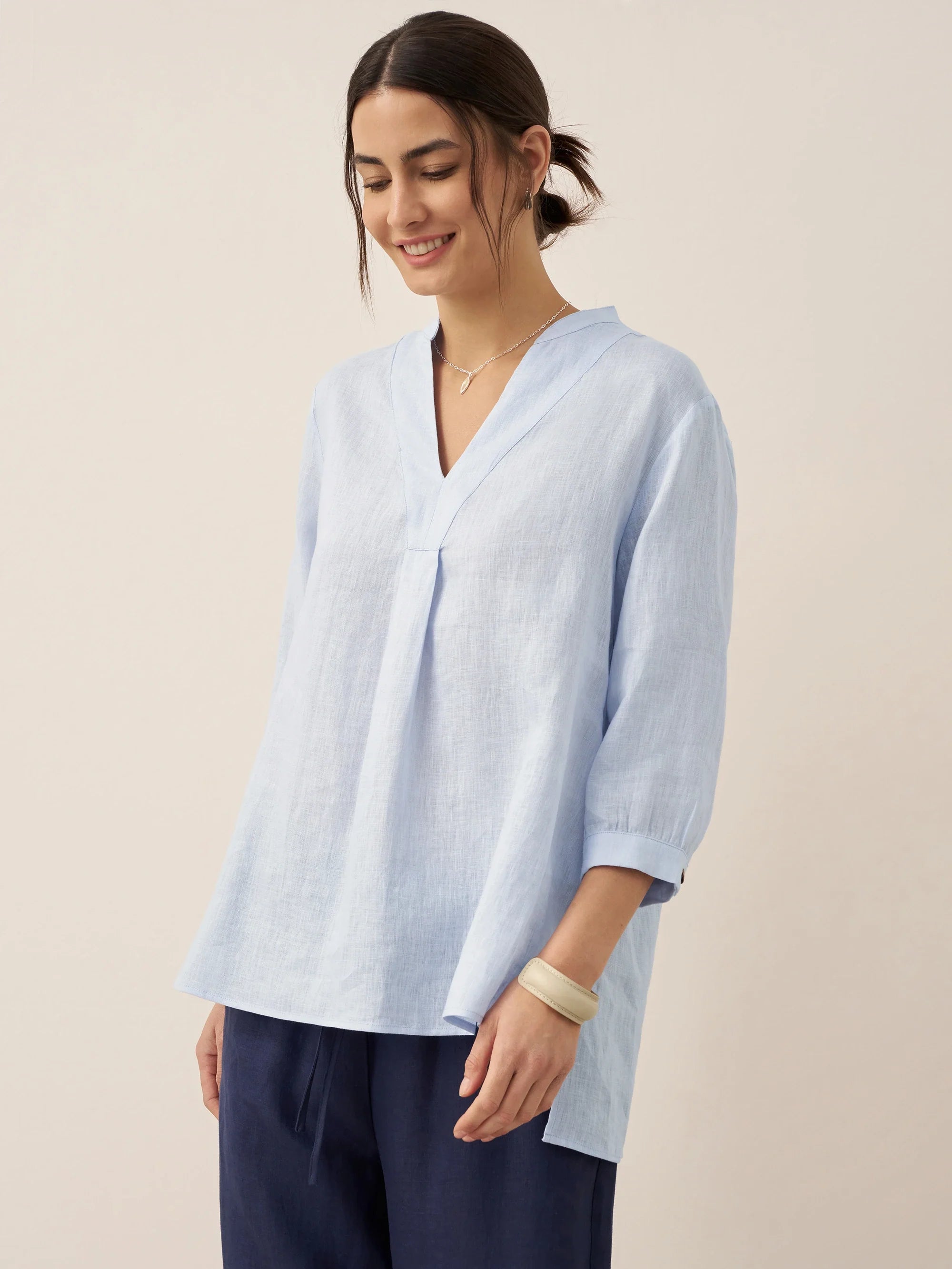 Relaxed-fit 100% linen shirt dress with stand-up collar and side vents in a soft natural tone