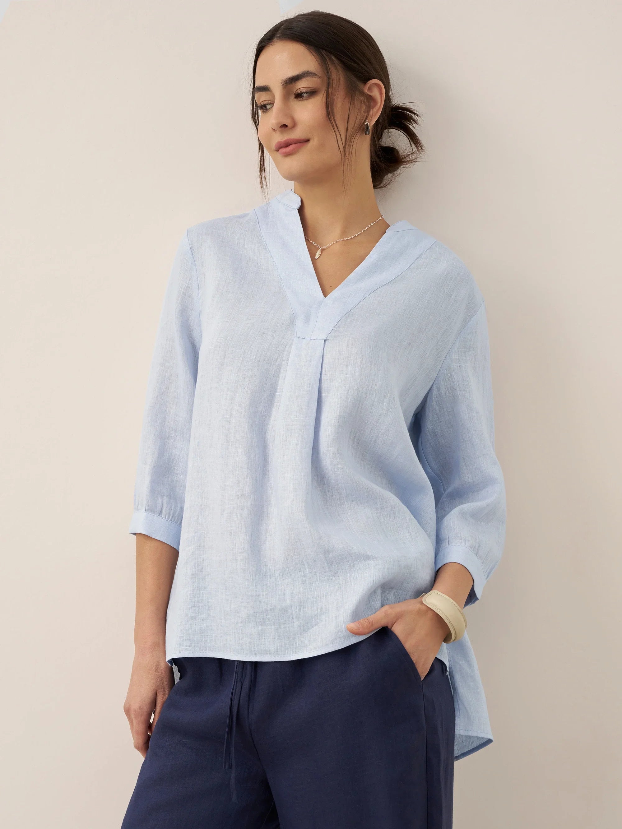 Relaxed-fit 100% linen shirt dress with stand-up collar and side vents in a soft natural tone