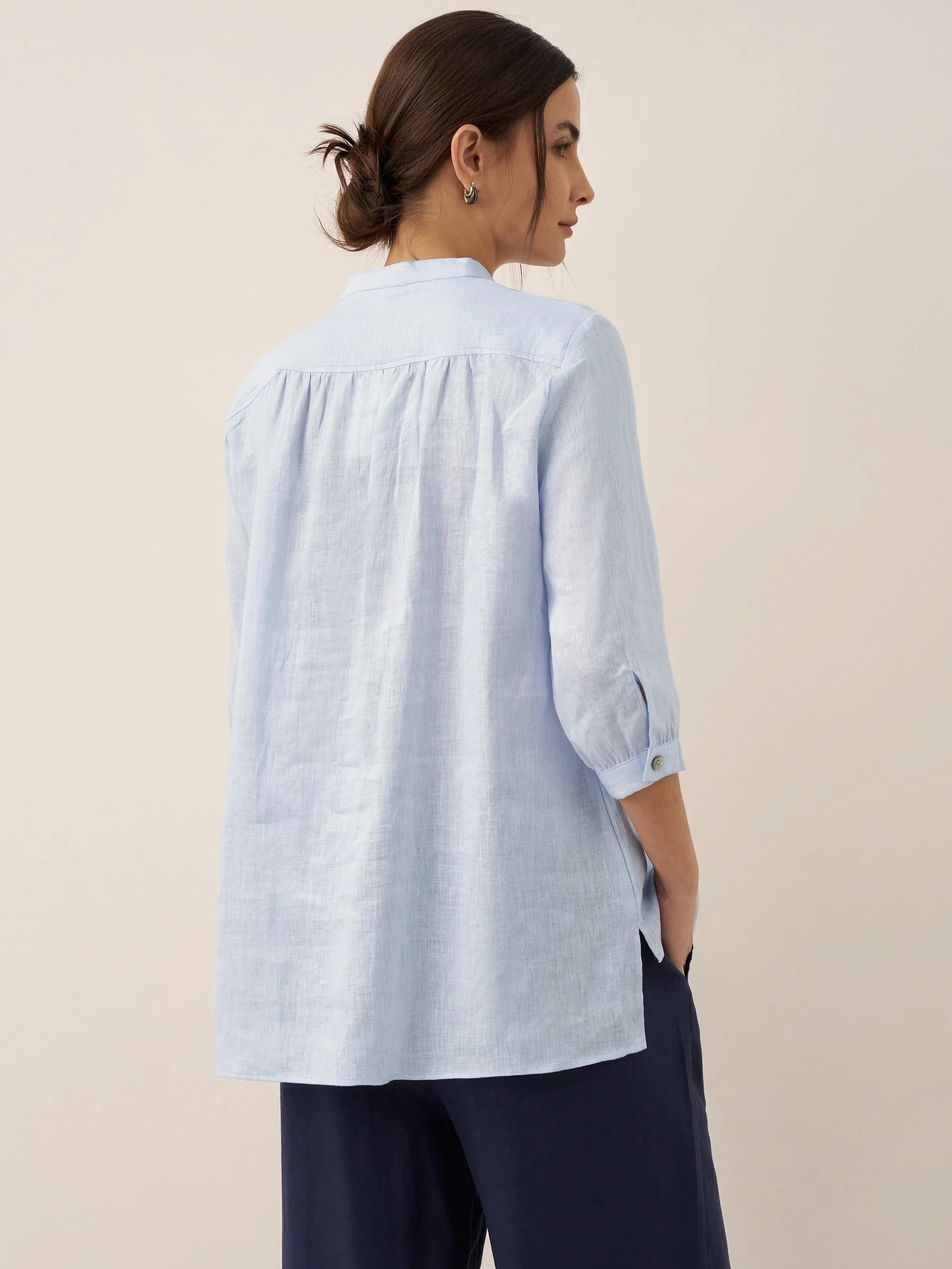 Relaxed-fit 100% linen shirt dress with stand-up collar and side vents in a soft natural tone