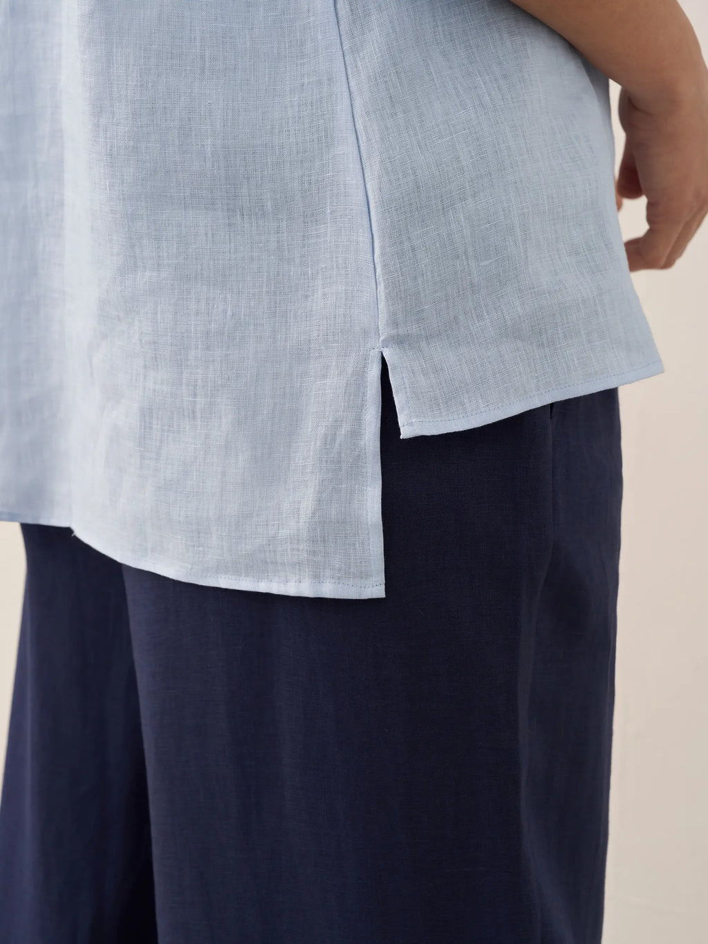 Relaxed-fit 100% linen shirt dress with stand-up collar and side vents in a soft natural tone