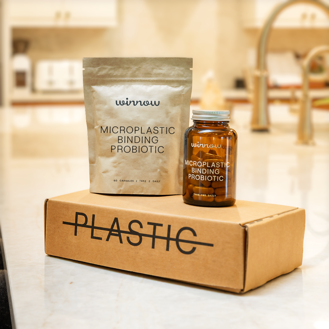 Daily probiotic starter kit in a reusable glass jar with white capsules and minimal packaging