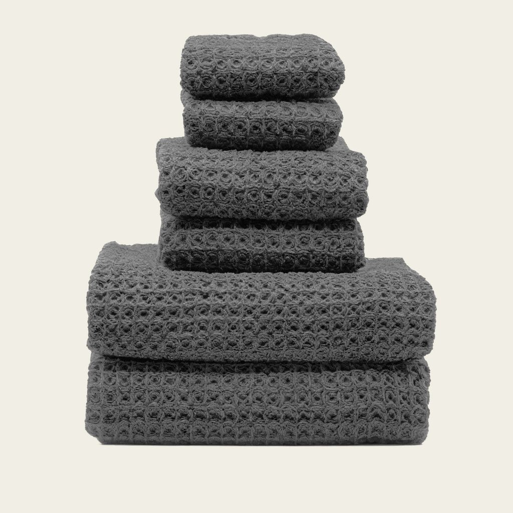 Folded Sedona Australian cotton waffle towels in a neutral colorway, showing dimensional open-weave texture