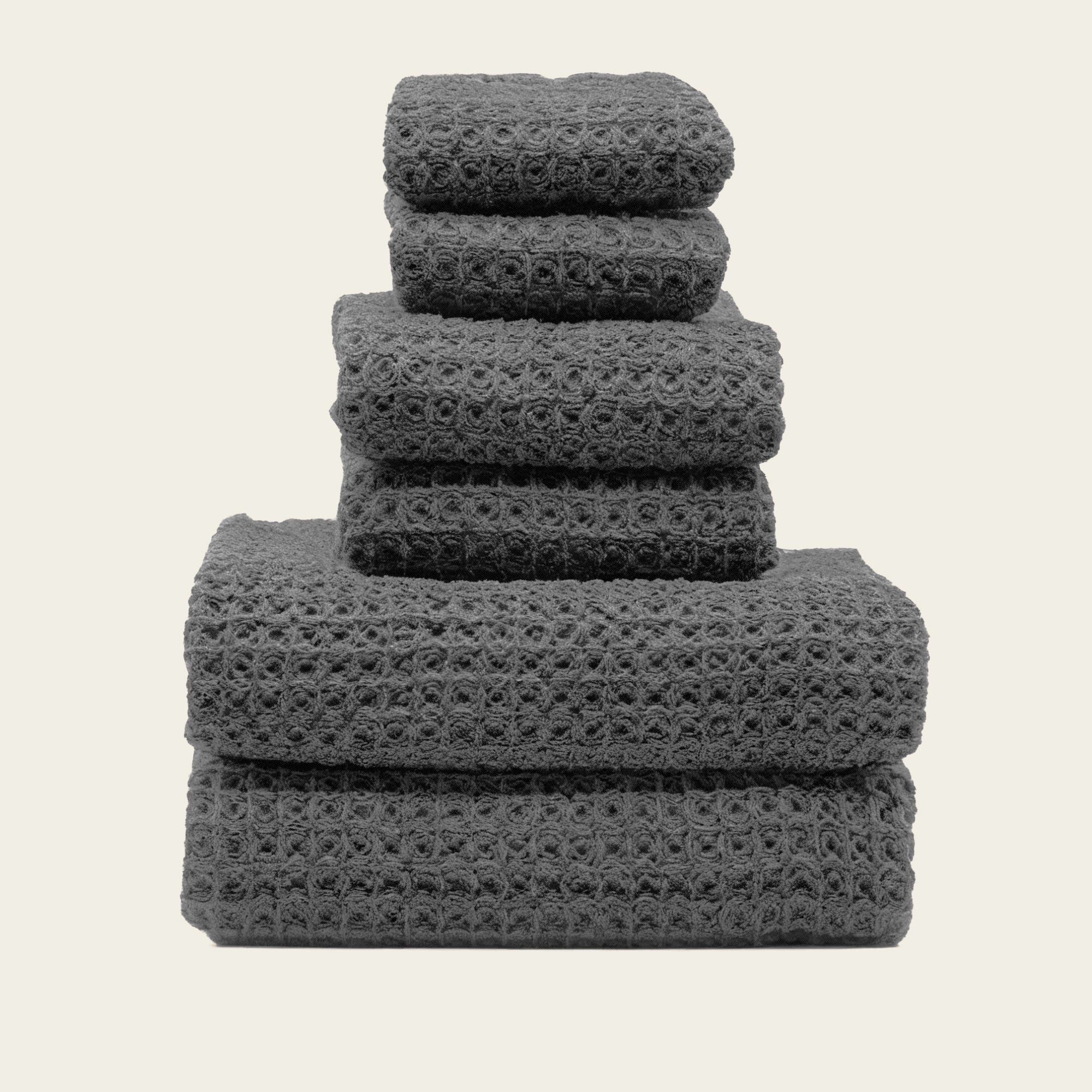 Folded Sedona Australian cotton waffle towels in a neutral colorway, showing dimensional open-weave texture