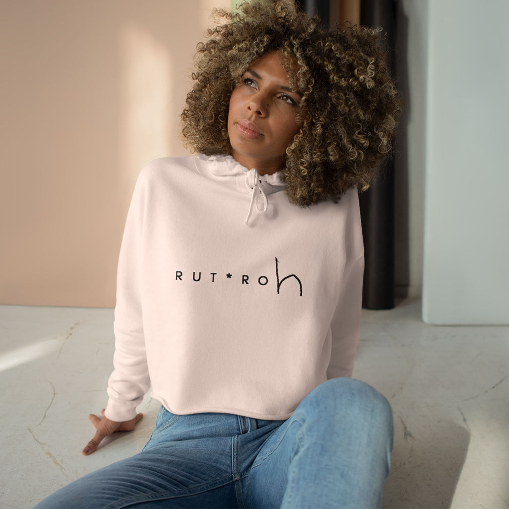 White cropped hoodie with minimal hand-drawn RUT*ROh chest graphic, dropped shoulders and raw hem, casual streetwear style