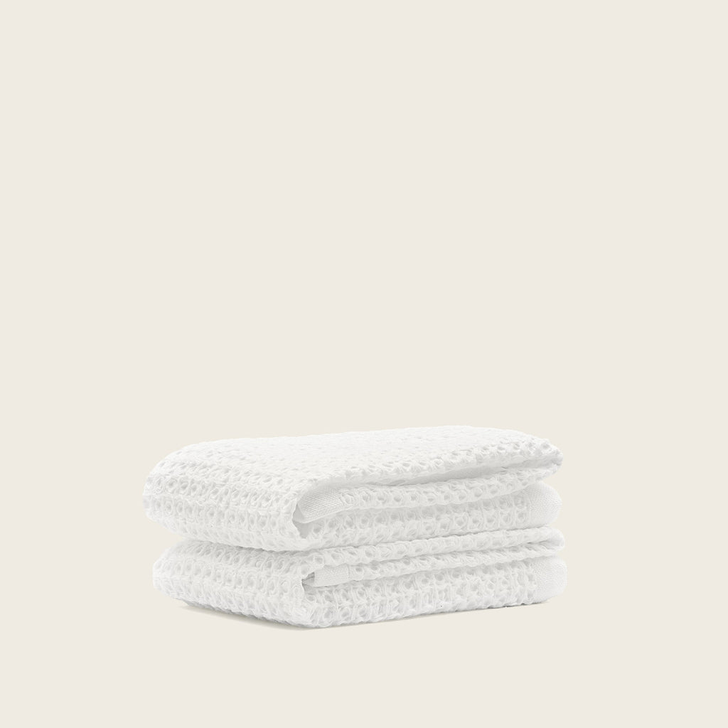 Folded Sedona Australian cotton waffle towels in a neutral colorway, showing dimensional open-weave texture