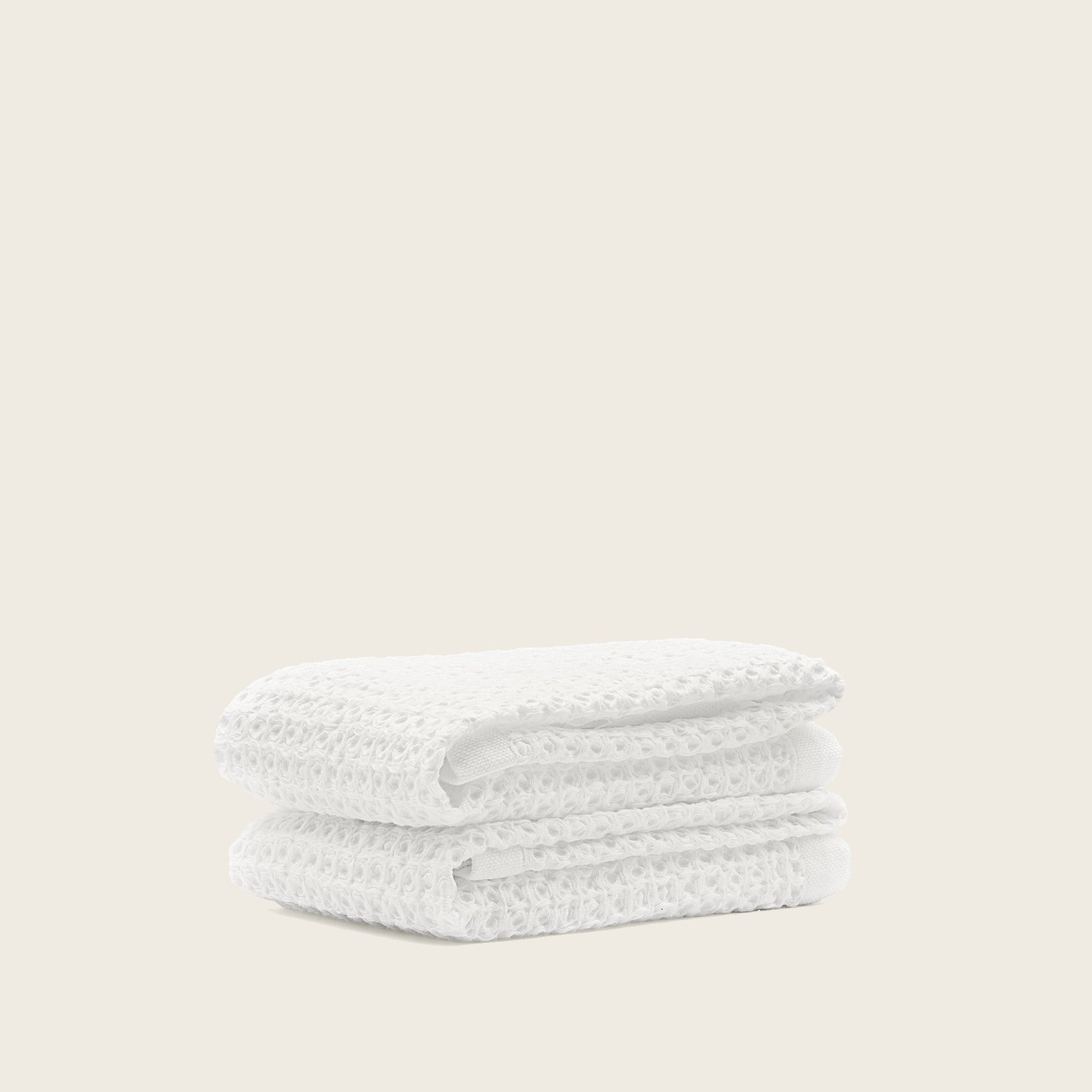 Folded Sedona Australian cotton waffle towels in a neutral colorway, showing dimensional open-weave texture