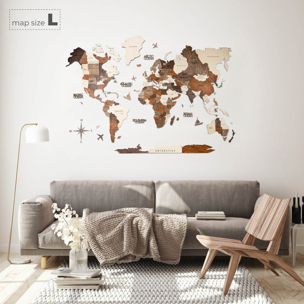 Multicolor 3D layered wooden world map wall art with engraved country names and borders mounted on a neutral wall