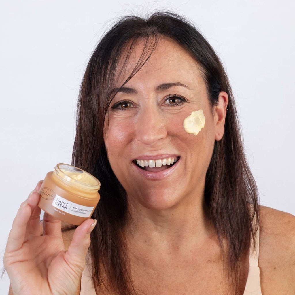 UpCircle Night Cream in glass jar with aluminum lid, showing hyaluronic acid and niacinamide overnight moisturizer