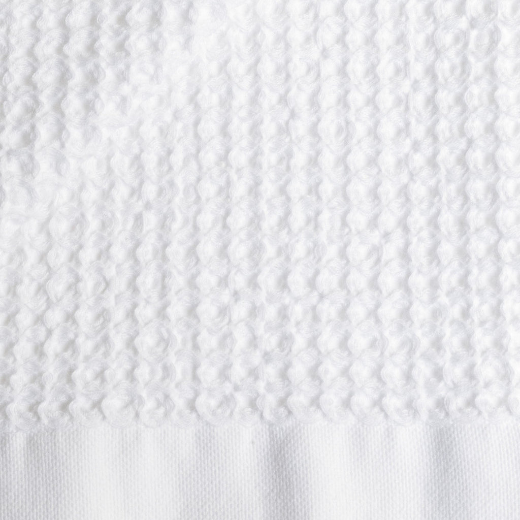 Folded Sedona Australian cotton waffle towels in a neutral colorway, showing dimensional open-weave texture