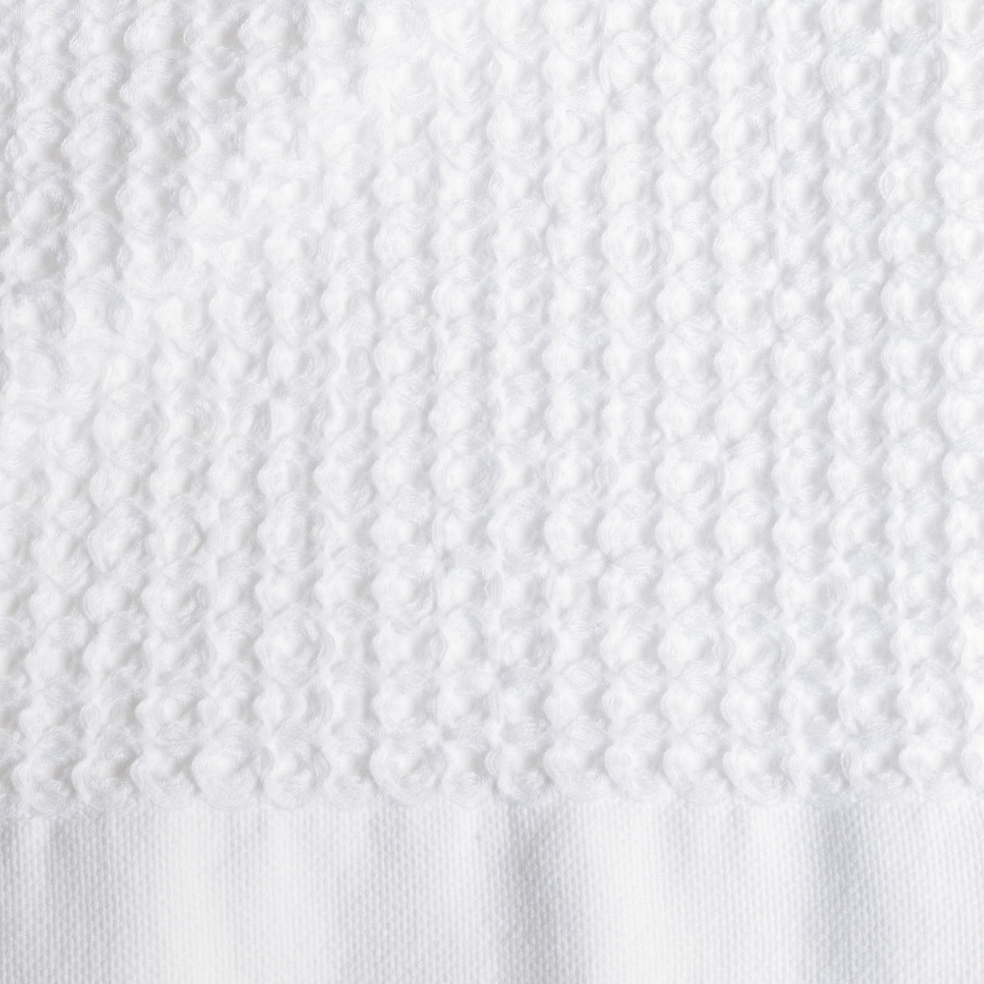 Folded Sedona Australian cotton waffle towels in a neutral colorway, showing dimensional open-weave texture