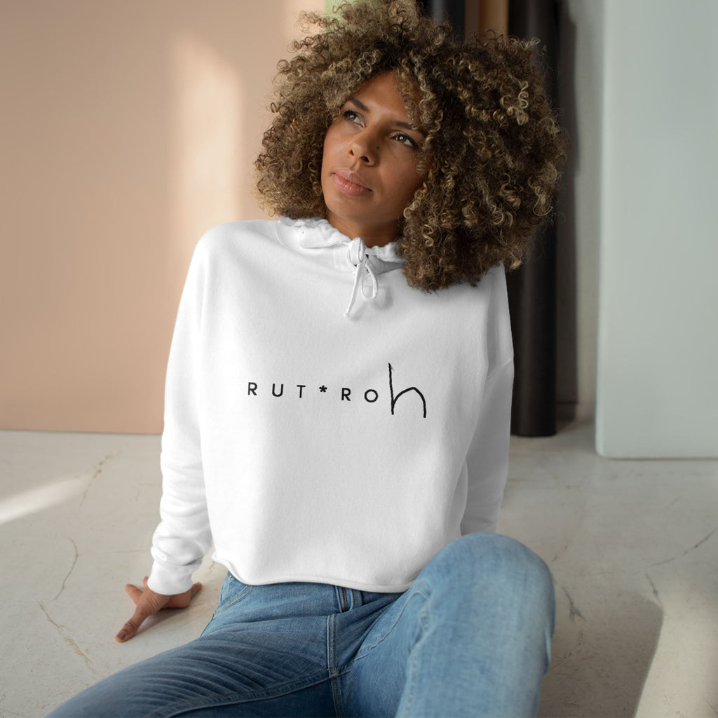 White cropped hoodie with minimal hand-drawn RUT*ROh chest graphic, dropped shoulders and raw hem, casual streetwear style