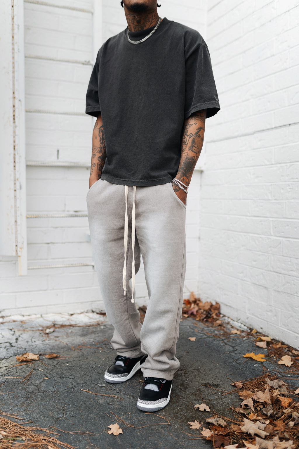 KTL Studios sun-dried bleached heavyweight cotton sweatpants with elastic waistband and outer drawstring, worn by male model