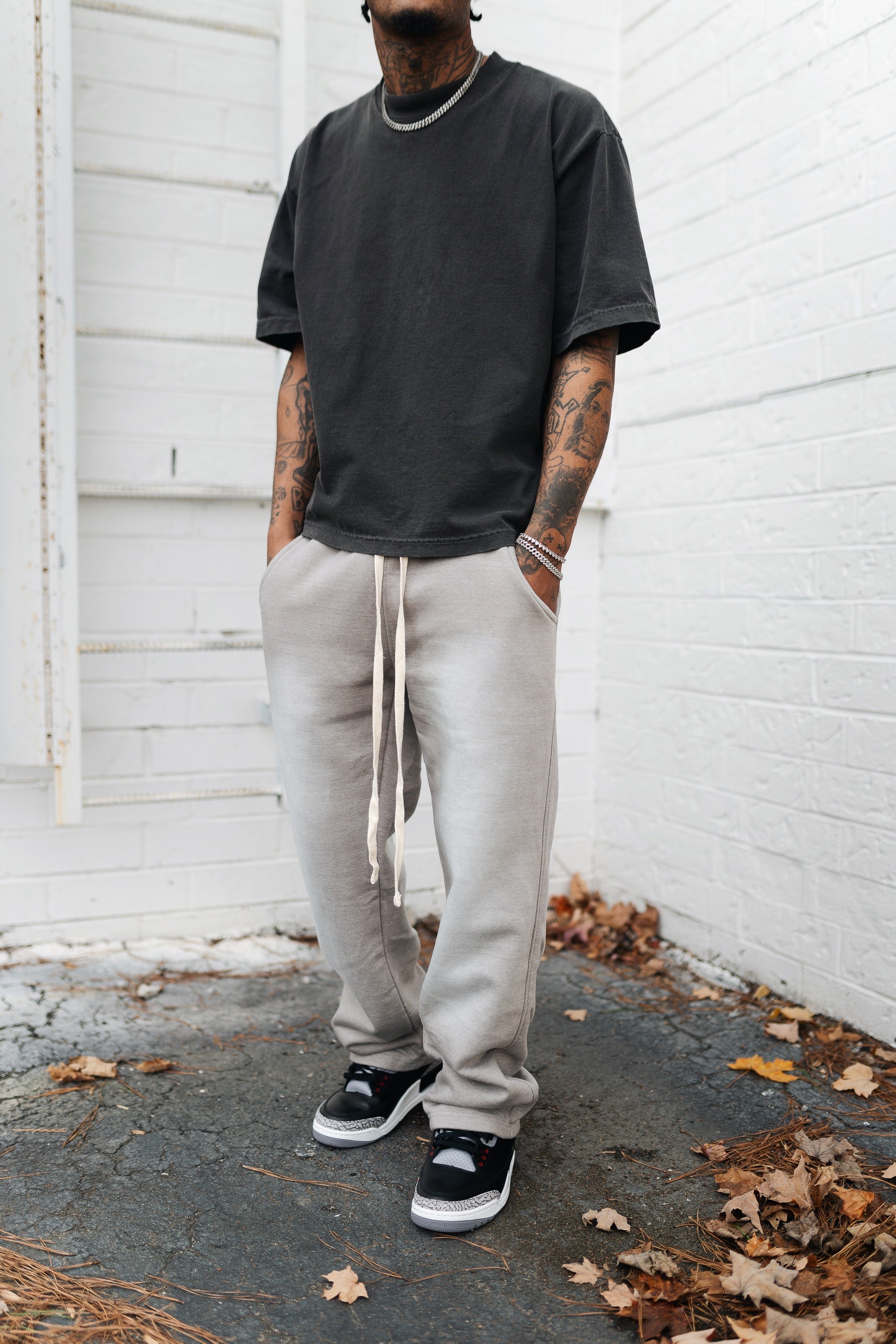 KTL Studios sun-dried bleached heavyweight cotton sweatpants with elastic waistband and outer drawstring, worn by male model