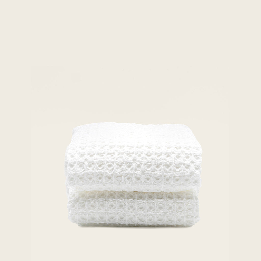 Folded Sedona Australian cotton waffle towels in a neutral colorway, showing dimensional open-weave texture