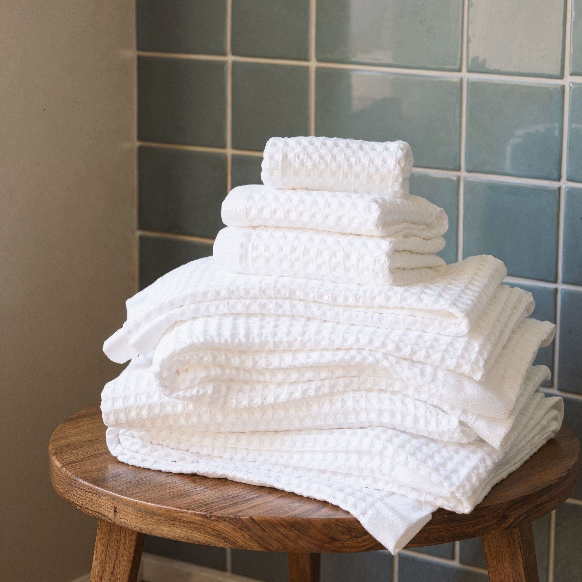 Folded Sedona Australian cotton waffle towels in a neutral colorway, showing dimensional open-weave texture
