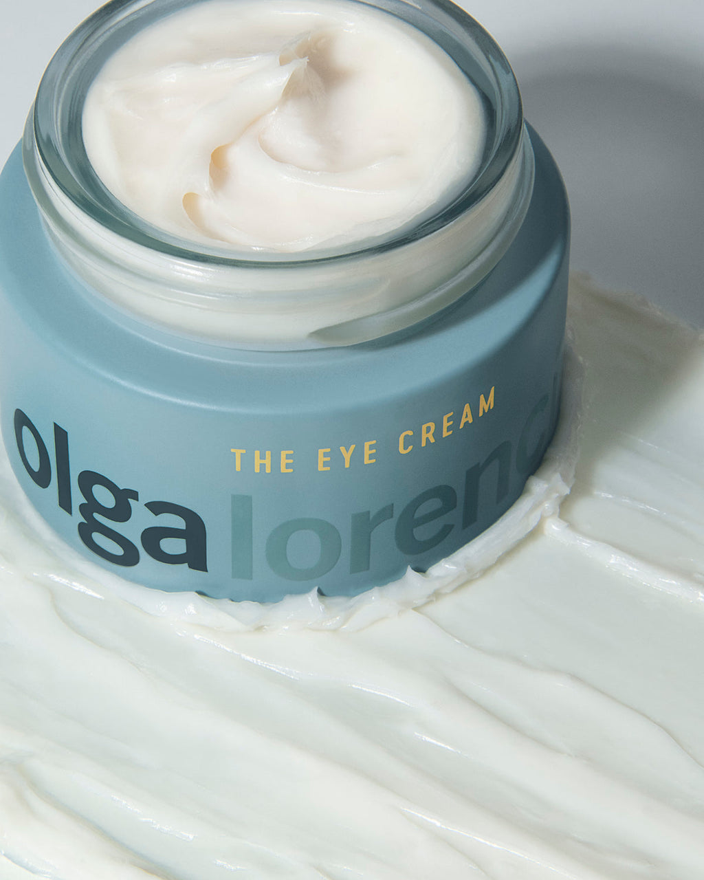 Olga Lorencin Skincare The Eye Cream 0.5 oz jar with Master Blend peptide and niacinamide formula on a neutral background