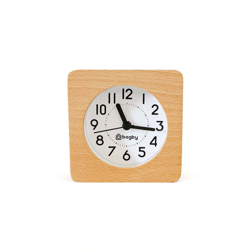 Bagby Classic solid wood analog alarm clock with numbered dial and night light on a nightstand