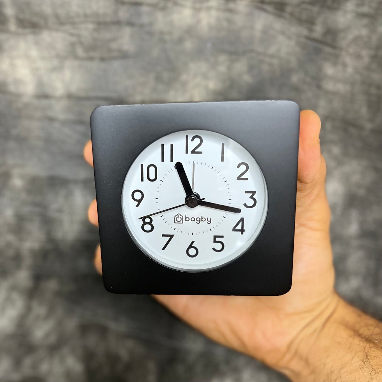 Bagby Classic solid wood analog alarm clock with numbered dial and night light on a nightstand