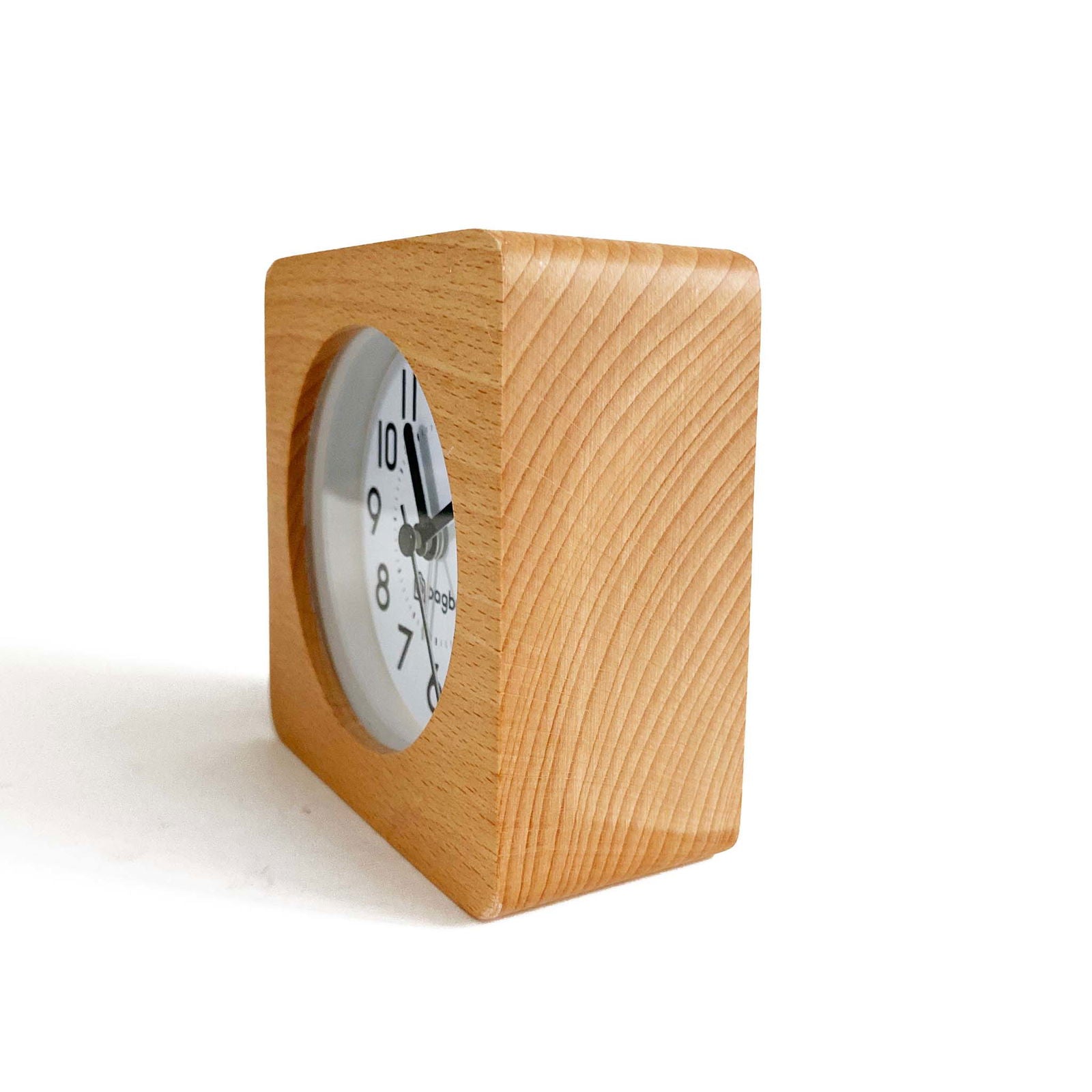 Bagby Classic solid wood analog alarm clock with numbered dial and night light on a nightstand
