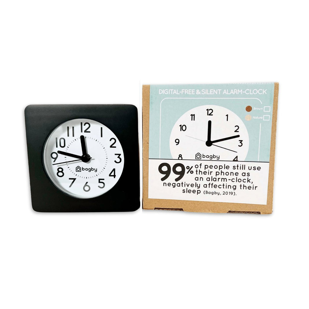 Bagby Classic solid wood analog alarm clock with numbered dial and night light on a nightstand