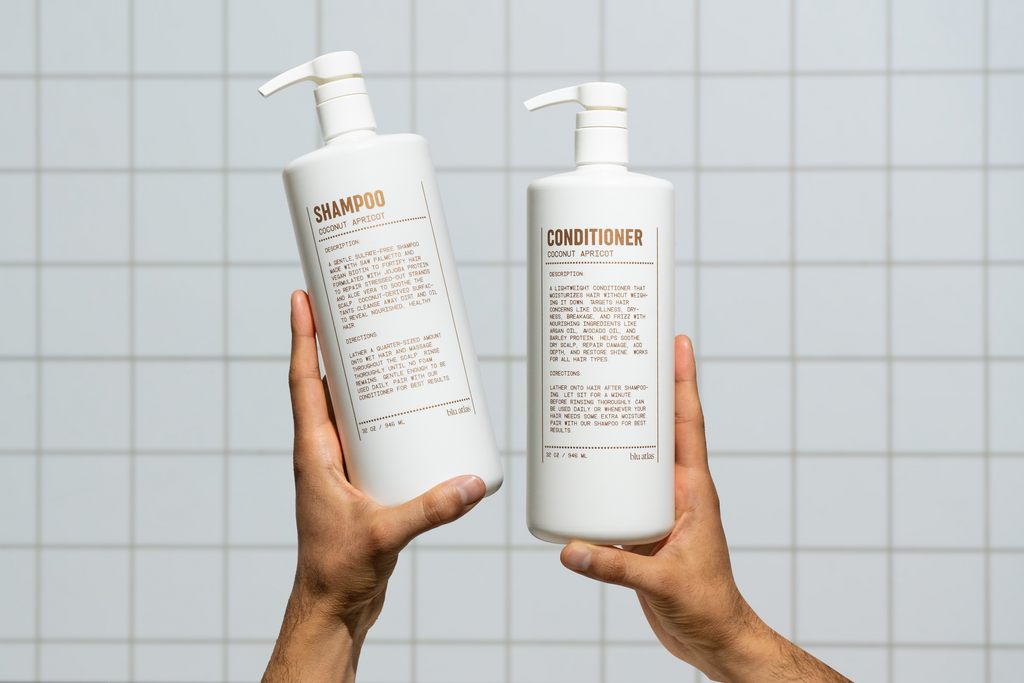 Bottle of natural daily shampoo with saw palmetto and vegan biotin on a clean surface