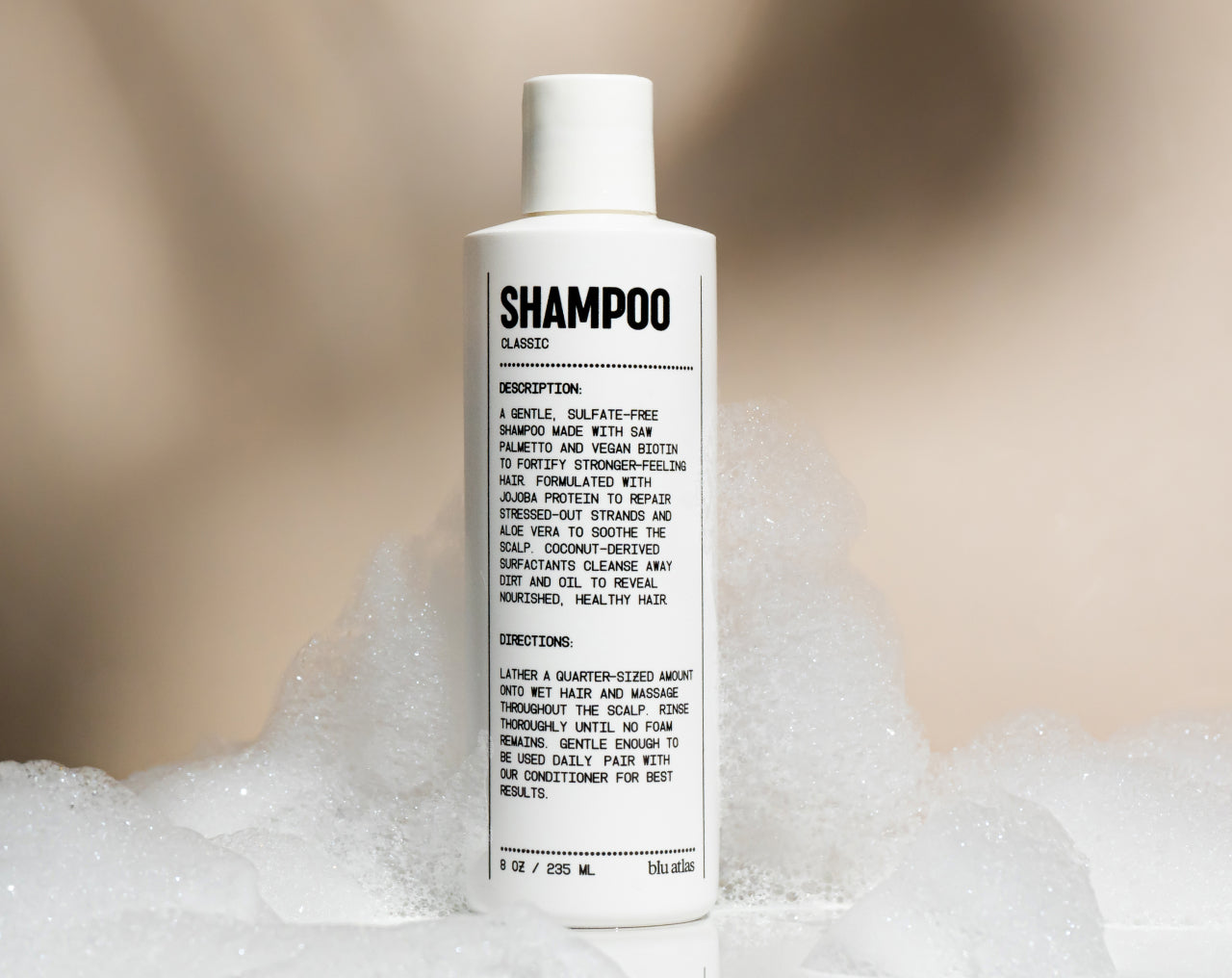 Bottle of natural daily shampoo with saw palmetto and vegan biotin on a clean surface